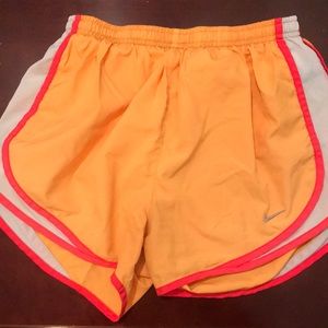 orange Nike tempos